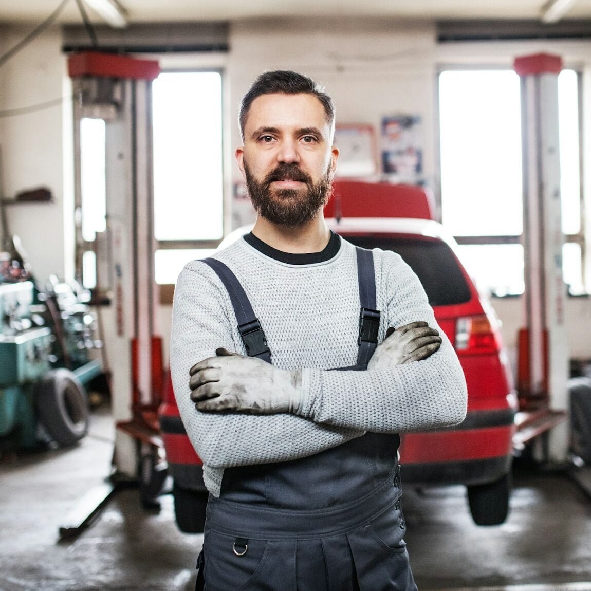 Portrait of a man mechanic in a garage.